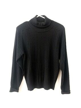 Black acrylic cable knit turtle neck.